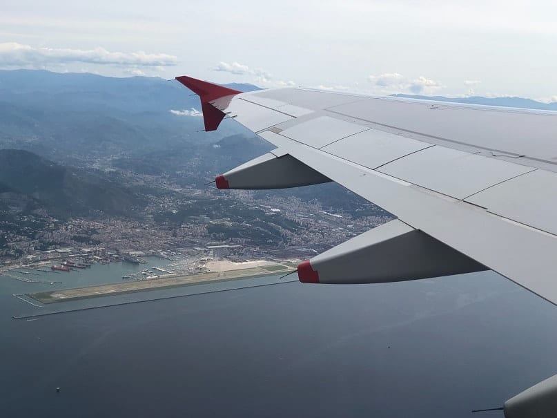 Plane flying over ocean