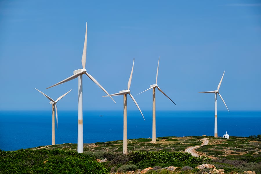 green renewable alternative energy wind generator turbines in crete island greece