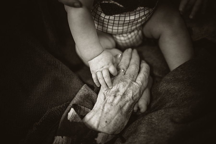 grandma and grandchild holding hands