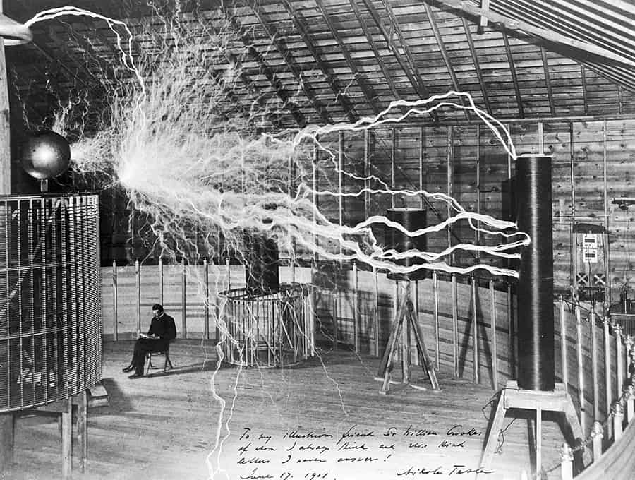 nikola tesla with his magnifying transmitter